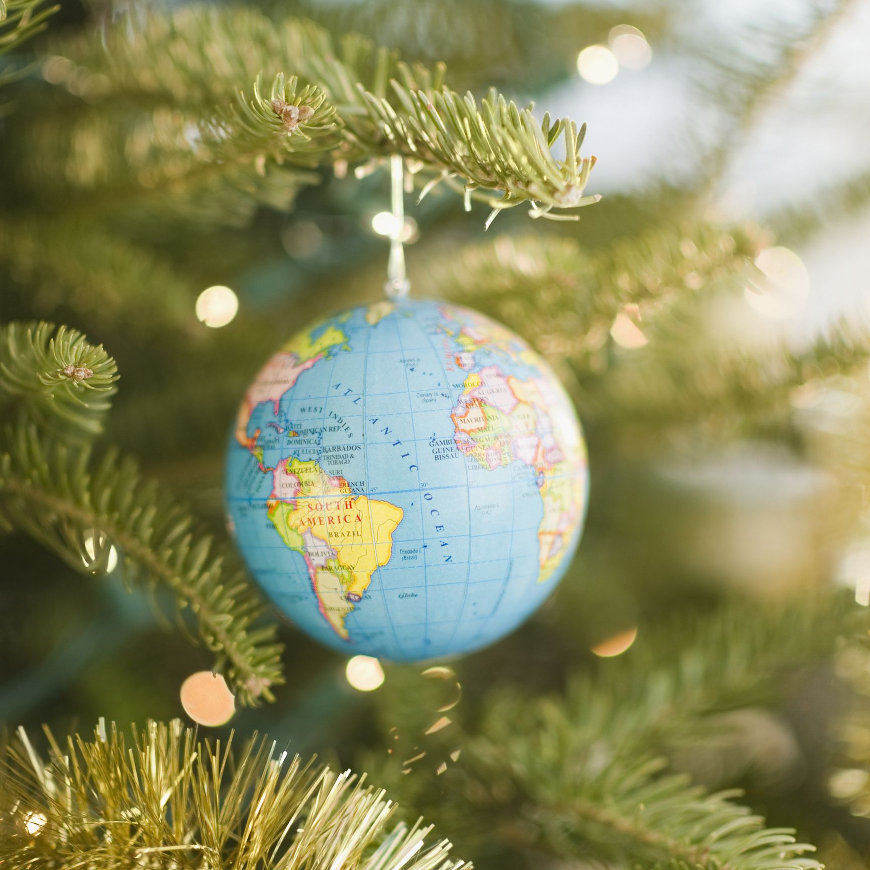 Earth ornament hanging on Christmas tree